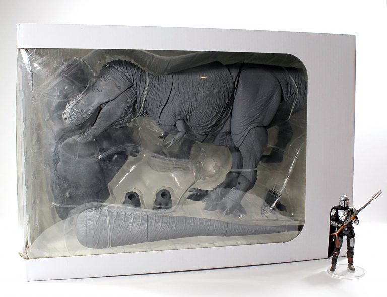 White box sample of 1/18th scale grey T. rex