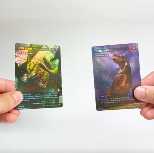 Kickstarter Zoic TCG Holographic Lizard Dragon and T. rex
